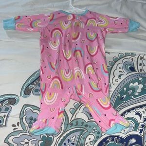 Onesie with rainbow designs, size newborn, material is cotton & good condition.